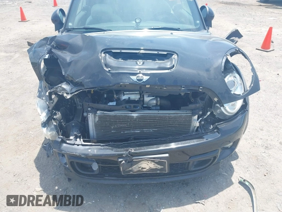 2013 MINI Convertible S with VIN WMWZP3C59DT550746, listed as a IAAI auction lot 39538986 with 59,934 mi miles and . Bid and sale history available at DreamBid. Image 14.
