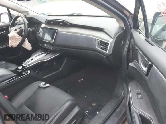 2018 Honda Clarity Touring z VIN JHMZC5F3XJC001054, wystawiony jako IAAI lot #42292688 z przebiegiem 60 780 mil mil oraz . Historia ofert i sprzedaży dostępna na DreamBid. Obrazek 5.