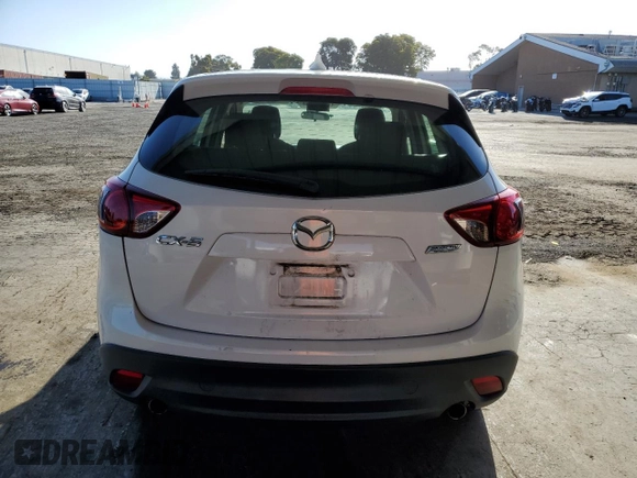 2013 Mazda CX-5 Sport with VIN JM3KE2BE7D0148951, listed as a Copart auction lot 57782115 with 65,677 mi miles and Salvage title. Bid and sale history available at DreamBid. Image 6.