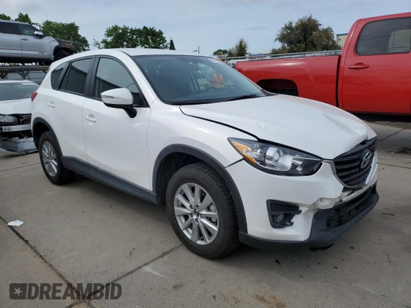 2016 Mazda CX-5 Touring with VIN JM3KE2CYXG0777715, listed as a Copart auction lot 52157005 with 58,585 mi miles and Salvage Title. Bid and sale history available at carsss.com. Image 4.