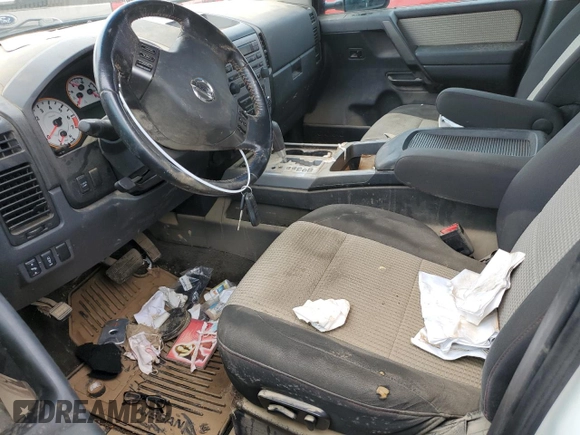 2010 Nissan Titan Pro-4X with VIN 1N6BA0EC3AN312601, listed as a Copart auction lot 52633455 with 161,260 mi miles and Salvage title. Bid and sale history available at DreamBid. Image 7.