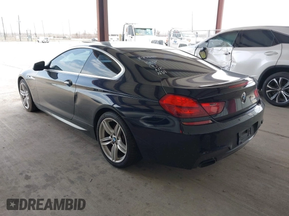 2012 BMW 6 Series 650i z VIN WBALX3C51CDV77602, wystawiony jako IAAI lot #41668235 z przebiegiem 103 684 mil mil oraz . Historia ofert i sprzedaży dostępna na DreamBid. Obrazek 3.