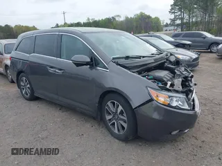 2014 Honda Odyssey Touring with VIN 5FNRL5H97EB117355, listed as a IAAI auction lot 41952283 with 122,439 mi miles and . Bid and sale history available at carsss.com. Image 1.