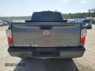 2017 Nissan Titan SL z VIN 1N6BA1F49HN514463, wystawiony jako Copart lot #51046805 z przebiegiem 99 686 mil mil oraz Szkody całkowita. Historia ofert i sprzedaży dostępna na DreamBid. Obrazek 6.