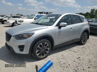 2016 Mazda CX-5 Grand Touring z VIN JM3KE4DY0G0734396, wystawiony jako Copart lot #60232305 z przebiegiem 80 373 mil mil oraz Czysty tytuł • Clean title. Historia ofert i sprzedaży dostępna na DreamBid. Obrazek 1.