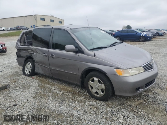 2000 Honda Odyssey EX with VIN 2HKRL1865YH513885, listed as a Copart auction lot 50223505 with 214,627 mi miles and Salvage Title. Bid and sale history available at DreamBid. Image 4.