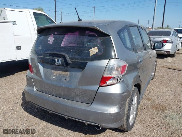 2009 Honda Fit Sport w/Navi with VIN JHMGE88619S020572, listed as a IAAI auction lot 41755126 with 202,358 mi miles. Bid and sale history available at carsss.com. Image 4.
