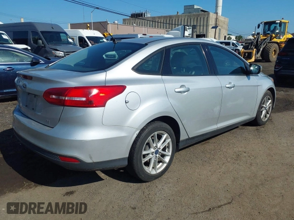 2015 Ford Focus SE with VIN 1FADP3F24FL301732, listed as a IAAI auction lot 42539183 with 127,045 mi miles and . Bid and sale history available at DreamBid. Image 4.