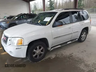 2003 GMC Envoy SLE with VIN 1GKDT13SX32319740, listed as a IAAI auction lot 41923578 with 210,811 mi miles. Bid and sale history available at carsss.com. Image 17.