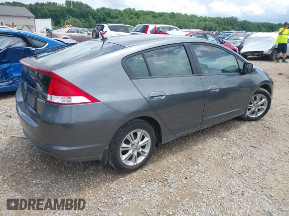 2010 Honda Insight EX with VIN JHMZE2H71AS008487, listed as a IAAI auction lot 42533409 with 95,765 mi miles and . Bid and sale history available at DreamBid. Image 4.