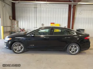 2016 Ford Fusion Titanium Hybrid with VIN 3FA6P0RU7GR127307, listed as a IAAI auction lot 41944427 with 128,076 mi miles. Bid and sale history available at carsss.com. Image 15.
