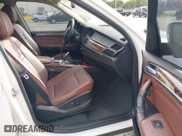 2011 BMW X5 35i with VIN 5UXZV4C54BL412770, listed as a IAAI auction lot 41618946 with 148,612 mi miles. Bid and sale history available at carsss.com. Image 5.