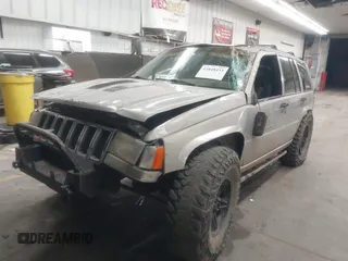 1998 Jeep Grand Cherokee Laredo with VIN 1J4GZ48Y9WC206957, listed as a IAAI auction lot 41848433 with 122,104 mi miles. Bid and sale history available at carsss.com. Image 17.
