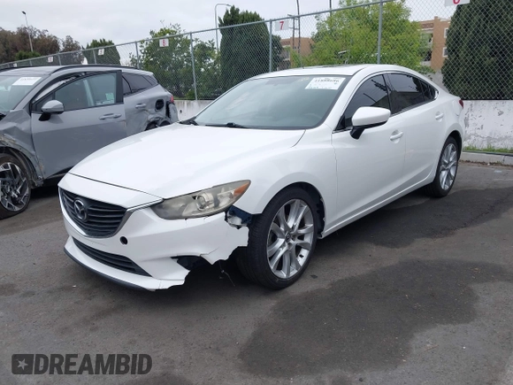 2016 Mazda Mazda6 i Touring with VIN JM1GJ1V52G1468807, listed as a IAAI auction lot 41888686 with 121,764 mi miles. Bid and sale history available at carsss.com. Image 2.