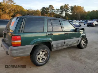 1997 Jeep Grand Cherokee TSi with VIN 1J4FX58SXVC565347, listed as a Copart auction lot 80953334 with 355,373 mi miles and Salvage Title. Bid and sale history available at carsss.com. Image 3.