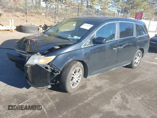2011 Honda Odyssey EX-L with VIN 5FNRL5H61BB059275, listed as a IAAI auction lot 41293690 with 105,511 mi miles and . Bid and sale history available at carsss.com. Image 17.