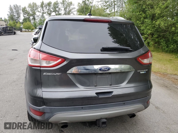 2015 Ford Escape Titanium with VIN 1FMCU9J93FUA67563, listed as a Copart auction lot 61770085 with 134,201 mi miles and Salvage title. Bid and sale history available at DreamBid. Image 6.