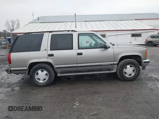 1999 GMC Yukon with VIN 1GKEK13R7XJ753243, listed as a IAAI auction lot 41231957 with 207,092 mi miles. Bid and sale history available at carsss.com. Image 13.