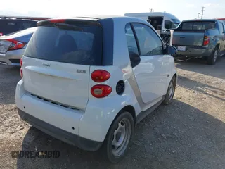 2015 Smart fortwo Passion with VIN WMEEJ3BA4FK800163, listed as a IAAI auction lot 42180126 with 53,138 mi miles. Bid and sale history available at carsss.com. Image 4.