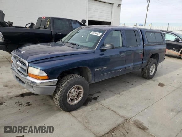 2002 Dodge Dakota SLT with VIN 1B7HG48N32S720700, listed as a Copart auction lot 80234494 with 207,035 mi miles and Salvage Title. Bid and sale history available at carsss.com. Image 1.