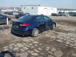 2023 Toyota Corolla Hybrid LE with VIN JTDBCMFE7PJ005985, listed as a IAAI auction lot 41574856 with 31,568 mi miles. Bid and sale history available at carsss.com. Image 4.