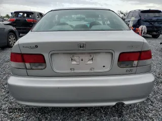 1999 Honda Civic EX z VIN 1HGEJ8241XL039353, wystawiony jako Copart lot #59477965 z przebiegiem 181 477 mil mil oraz Nie do naprawy • Non repairable. Historia ofert i sprzedaży dostępna na DreamBid. Obrazek 6.