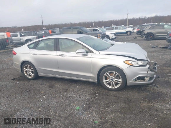 2018 Ford Fusion SE z VIN 3FA6P0HD2JR207865, wystawiony jako IAAI lot #41835895 z przebiegiem 91 069 mil mil oraz . Historia ofert i sprzedaży dostępna na DreamBid. Obrazek 13.