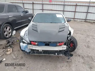 2016 Nissan 370Z Sport z VIN JN1AZ4EH1GM930883, wystawiony jako IAAI lot #41909945 z przebiegiem 80 484 mil mil oraz . Historia ofert i sprzedaży dostępna na DreamBid. Obrazek 13.