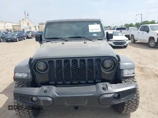 2021 Jeep Gladiator Sport S z VIN 1C6JJTAM1ML607525, wystawiony jako IAAI lot #41941550 z przebiegiem 59 283 mil mil oraz . Historia ofert i sprzedaży dostępna na DreamBid. Obrazek 12.