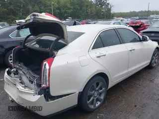 2014 Cadillac ATS Luxury AWD z VIN 1G6AH5RX1E0147092, wystawiony jako IAAI lot #40321476 z przebiegiem 115 224 mil mil oraz . Historia ofert i sprzedaży dostępna na DreamBid. Obrazek 4.