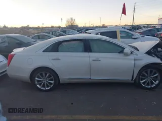 2014 Cadillac XTS Premium with VIN 2G61P5S30E9123057, listed as a IAAI auction lot 41301457 with 123,042 mi miles and . Bid and sale history available at DreamBid. Image 13.
