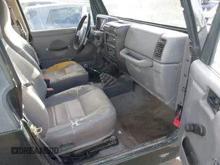 1998 Jeep Wrangler SE with VIN 1J4FY29P1WP760687, listed as a IAAI auction lot 41720889 with 210,592 mi miles. Bid and sale history available at carsss.com. Image 5.