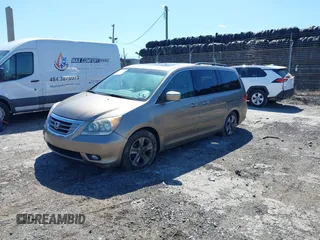 2010 Honda Odyssey Touring with VIN 5FNRL3H9XAB094765, listed as a IAAI auction lot 41892743 with 127,143 mi miles. Bid and sale history available at carsss.com. Image 17.