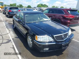 2004 Acura RL w/Navigation System z VIN JH4KA96614C002249, wystawiony jako IAAI lot #42309557 z przebiegiem 125 671 mil mil oraz . Historia ofert i sprzedaży dostępna na DreamBid. Obrazek 1.