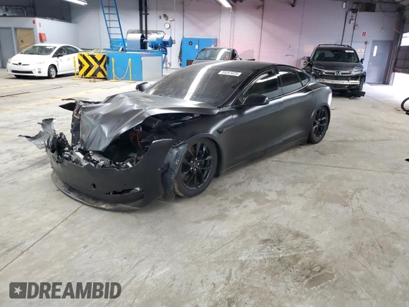 2022 Tesla Model S Plaid с VIN 5YJSA1E65NF487665, выставлен на аукционе Copart как лот 55261025 с пробегом Не указан миль и Списание • Salvage title. История ставок и продаж доступна на DreamBid. Изображение 1.