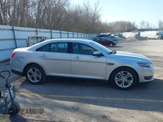 2013 Ford Taurus SEL with VIN 1FAHP2E8XDG191132, listed as a IAAI auction lot 41833542 with 165,125 mi miles. Bid and sale history available at carsss.com. Image 13.