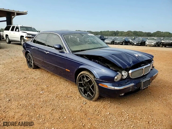 2004 Jaguar XJ with VIN SAJWA71C34SG19800, listed as a Copart auction lot 71877194 with 157,051 mi miles and Salvage Title. Bid and sale history available at carsss.com. Image 11.