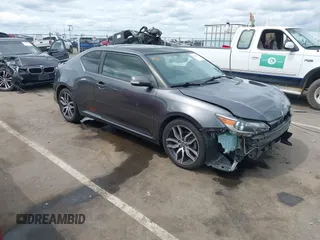 2015 Scion tC with VIN JTKJF5C73FJ008663, listed as a IAAI auction lot 41969395 with 125,758 mi miles. Bid and sale history available at carsss.com. Image 1.