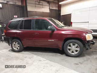 2002 GMC Envoy SLT with VIN 1GKDT13SX22426320, listed as a IAAI auction lot 41709359 with 104,418 mi miles. Bid and sale history available at carsss.com. Image 13.