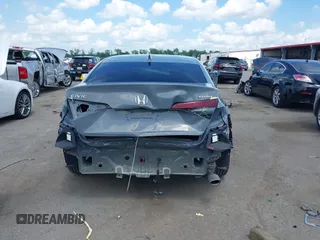 2025 Honda Civic Sport with VIN 2HGFE2F54SH564003, listed as a IAAI auction lot 42123436 with 7,042 mi miles and . Bid and sale history available at DreamBid. Image 17.