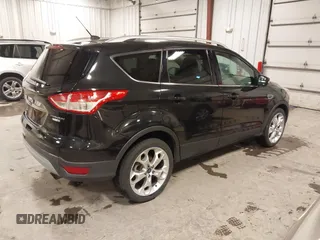 2014 Ford Escape Titanium with VIN 1FMCU9J95EUD85537, listed as a IAAI auction lot 41472236 with 154,796 mi miles. Bid and sale history available at carsss.com. Image 4.