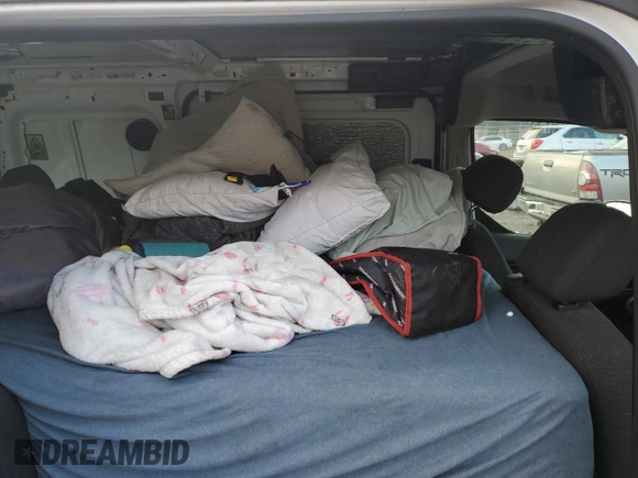 2018 Ford Transit Connect XL with VIN NM0LE7E75J1357681, listed as a Copart auction lot 82233674 with 90,725 mi miles and Salvage title. Bid and sale history available at DreamBid. Image 11.