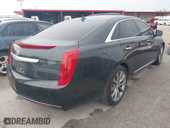 2014 Cadillac XTS z VIN 2G61L5S32E9326141, wystawiony jako IAAI lot #42300854 z przebiegiem 200 284 mil mil oraz . Historia ofert i sprzedaży dostępna na DreamBid. Obrazek 4.