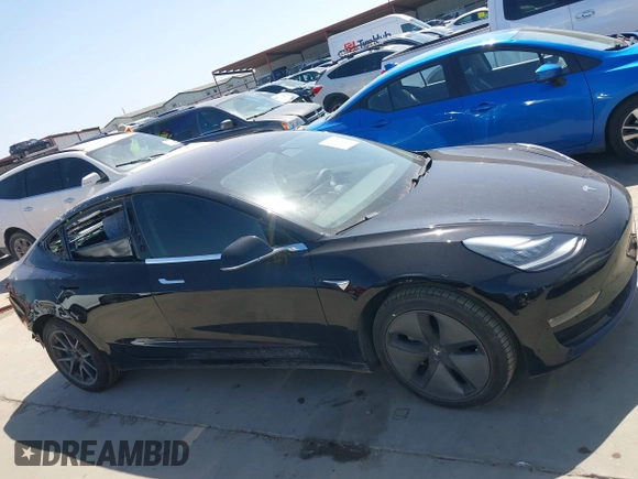 2018 Tesla Model 3 Long Range Battery with VIN 5YJ3E1EA7JF098632, listed as a IAAI auction lot 42002181 with 73,371 mi miles and . Bid and sale history available at DreamBid. Image 14.