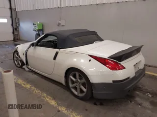 2005 Nissan 350Z Touring with VIN JN1AZ36A45M754923, listed as a IAAI auction lot 41720671 with 124,916 mi miles. Bid and sale history available at carsss.com. Image 3.