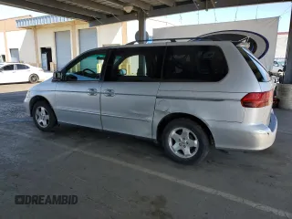 2001 Honda Odyssey EX z VIN 2HKRL18601H559033, wystawiony jako Copart lot #57119025 z przebiegiem 333 068 mil mil oraz Szkoda całkowita • Salvage title. Historia ofert i sprzedaży dostępna na DreamBid. Obrazek 2.