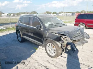 2012 Volkswagen Tiguan SE with VIN WVGAV7AX8CW565863, listed as a IAAI auction lot 41528643 with 122,569 mi miles and . Bid and sale history available at DreamBid. Image 1.