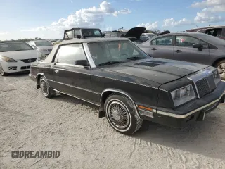 1985 Chrysler LeBaron Mark Cross z VIN 1C3BC55E0FG160918, wystawiony jako Copart lot #76659284 z przebiegiem Nie podano mil oraz Szkody całkowita. Historia ofert i sprzedaży dostępna na DreamBid. Obrazek 4.