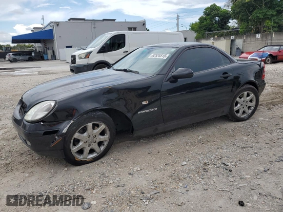 2000 Mercedes-Benz SLK 230 Kompressor with VIN WDBKK47F0YF149827, listed as a Copart auction lot 62524515 with 62,005 mi miles and Salvage title. Bid and sale history available at DreamBid. Image 1.
