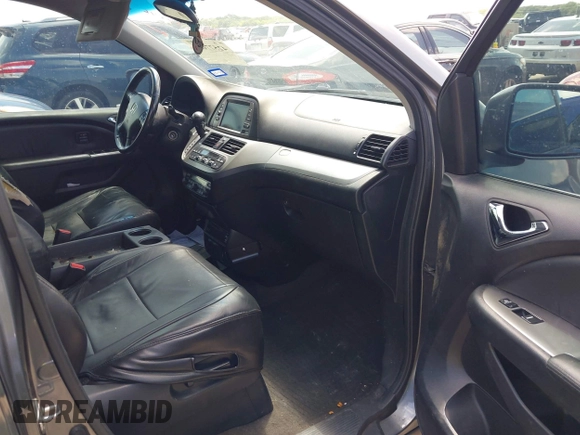 2010 Honda Odyssey Touring with VIN 5FNRL3H90AB053710, listed as a IAAI auction lot 42577646 with 255,351 mi miles and . Bid and sale history available at DreamBid. Image 5.
